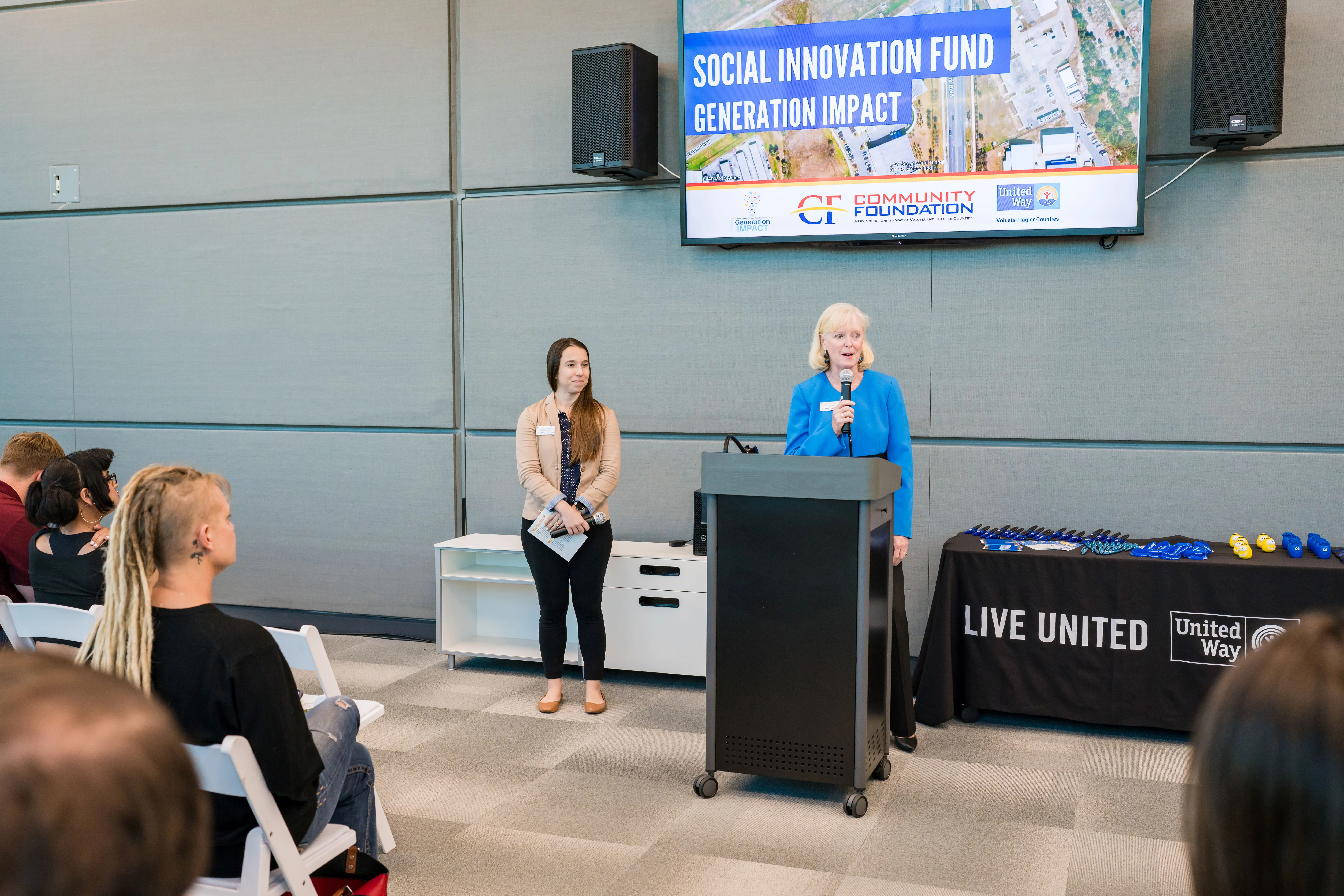 Board president delivering opening remarks.