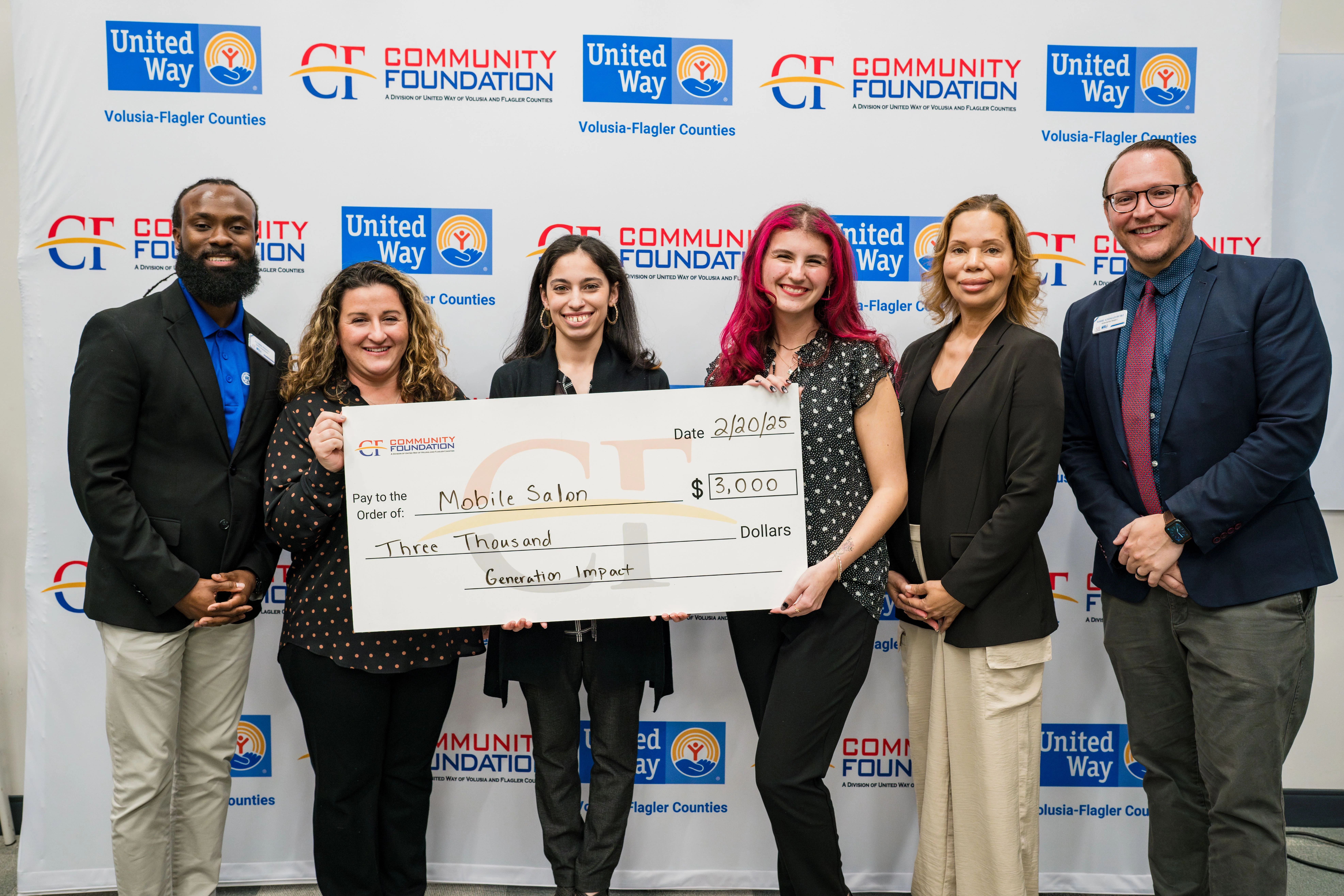 DSC Mobile Salon team with "big check."