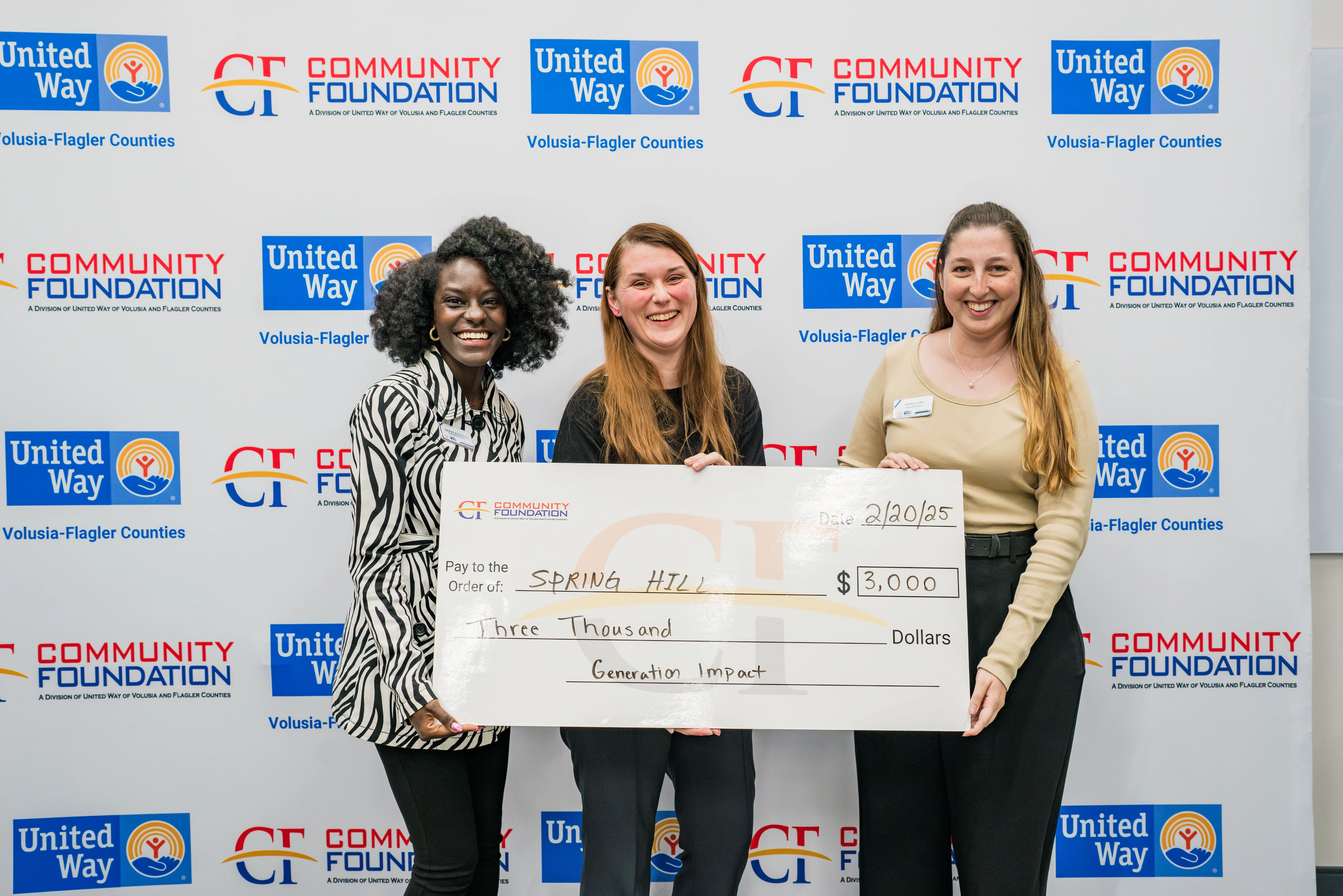 Spring Hill team with "big check."