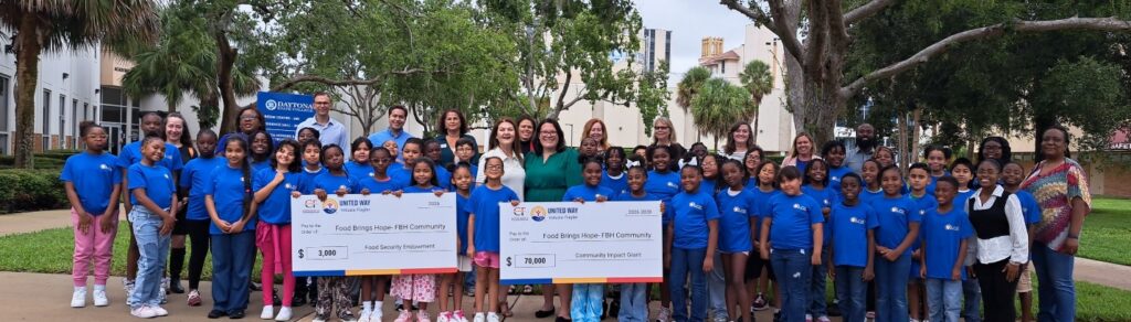 Food Brings Hope FBH Community Check - Grooup of people standing with check